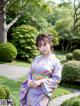 A woman in a purple kimono standing in a garden.